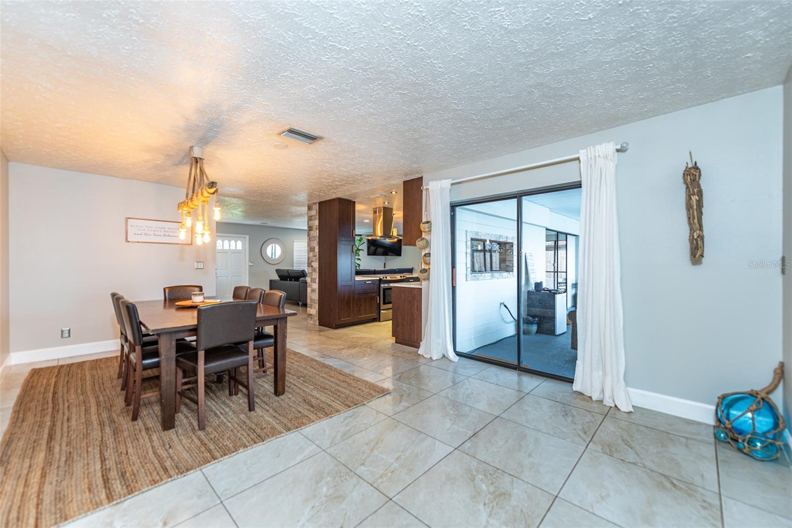 Dining room with access to patio and pool