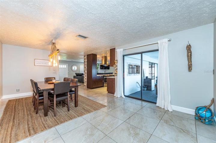 Dining room with access to patio and pool