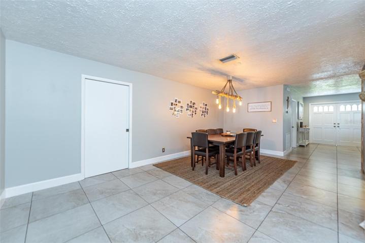 Dining room with access to patio and pool