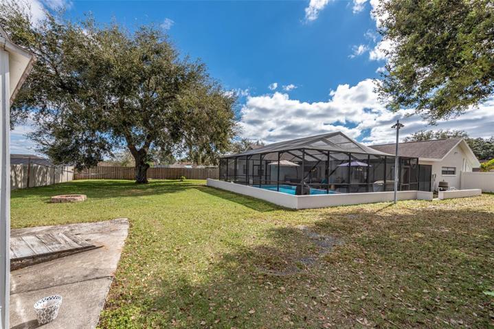 Backyard from shed with large parking area