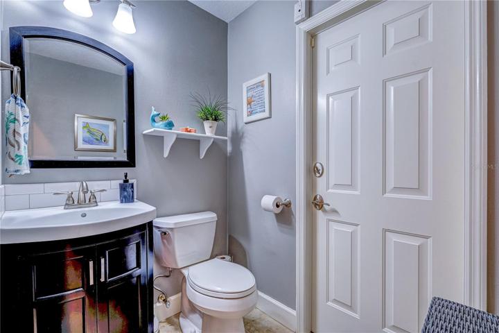 Half bath leading to the pool area.
