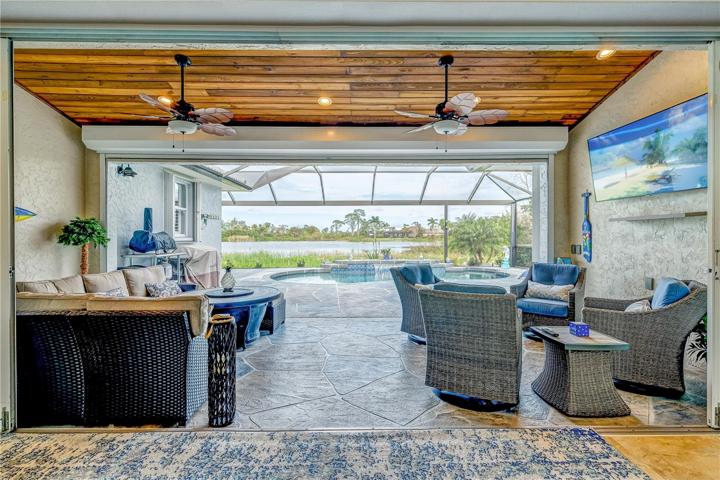 Stunning cedar ceiling and panoramic screens looking out to the lake!