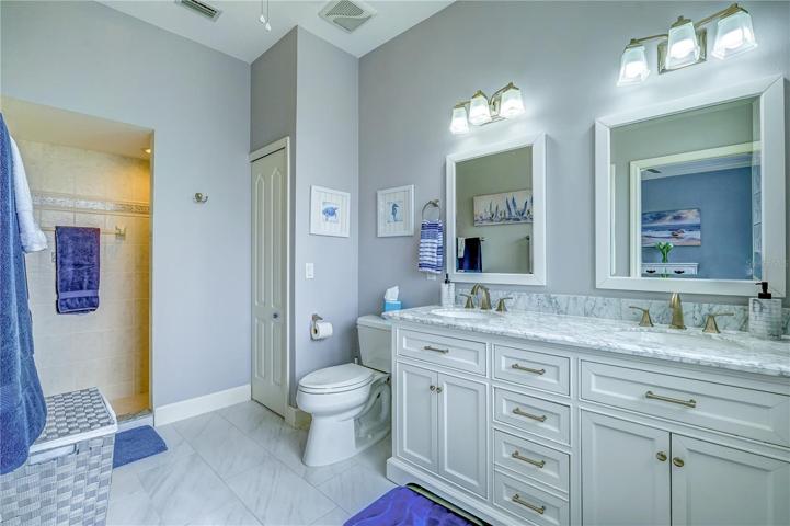 Ensuite bathroom of 2nd bedroom. Shower is huge!