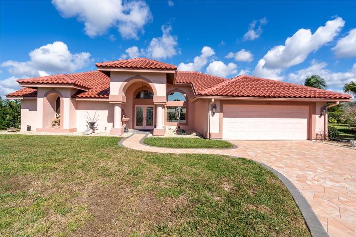 stunning Arthur Rutenberg home in Quail Lake community. Pavered driveway with dark border. New Roof 70k+. I believe he said the facia board is Cedar.