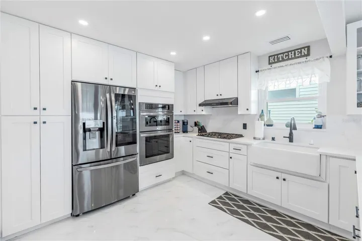 See Through Refrigerator Door & Double Oven with Microwave Covection oven and Conventional Convection Oven.