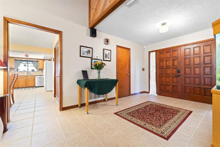 Ample foyer and storage adjacent to the kitchen