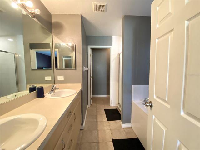 Master Bathroom with Double Sinks, Soaking Tub, Private Toilet, and Huge Walk-in Shower.