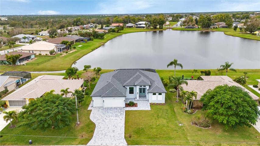 Front view w/lake view in rear