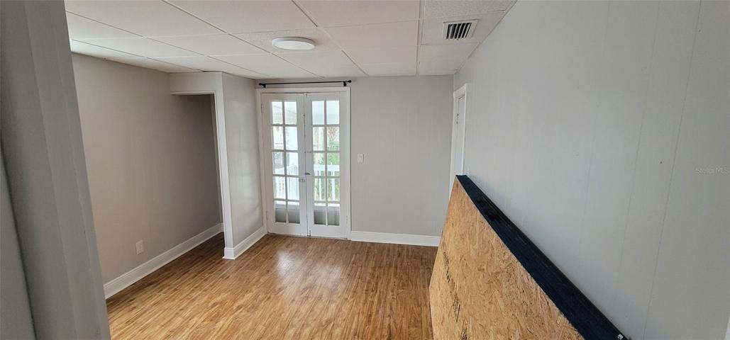 Apt 4 Living Area with French doors to Balcony
