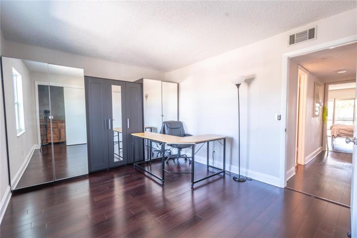 Bedroom 3 has a wood laminate flooring and built in closets.