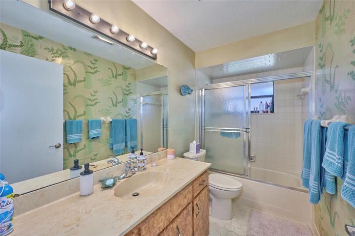 Guest bath offers a tub/shower combination