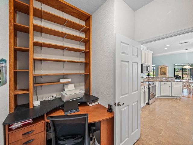 Desk & bookcase in laundry room