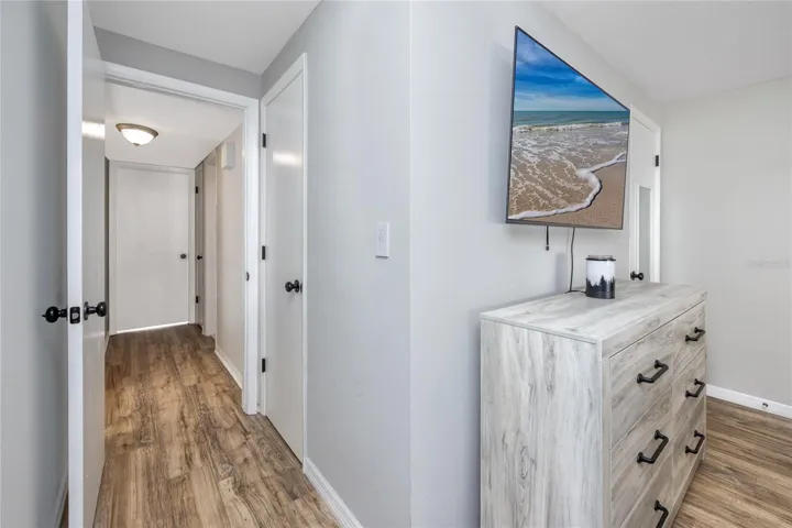Primary Bedroom with a walk in closet and en suite