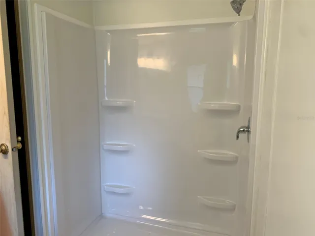 Primary bathroom with new step in shower.