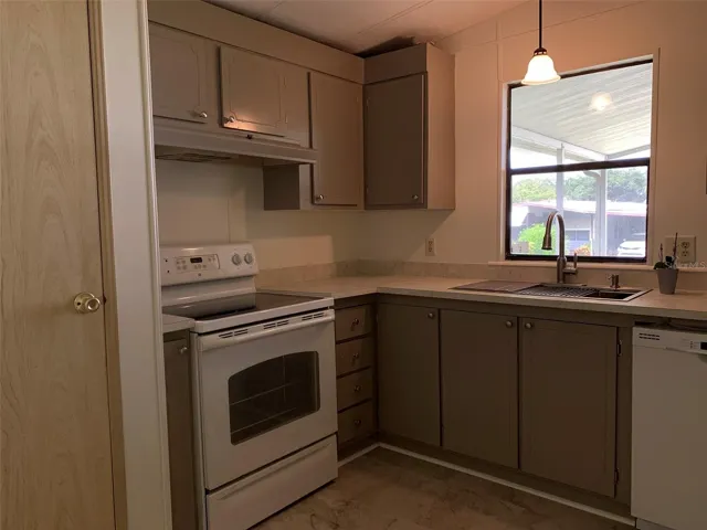 New lighting, flooring, counters, cabinets, sink.