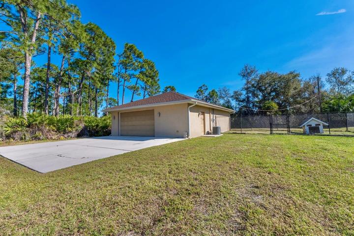 additional air conditioned 1,200 sqft detached garage (fit 6 cars total!) - that’s 1,640sqft of garage space total!! This second garage is a dream in itself – a paradise for hobbyists, car enthusiasts, or potential investors - as it is a 40’ x 30’ detached garage constructed of solid block (not wood frame) and ideal for a workshop, working on cars (deep enough for tandem parking) or opportunity for investment income by converting to a living space, as it has its own HVAC system, electrical breaker and account with FPL. Oversized parking pad on the attached garage for your bigger vehicles while having an additional parking pad (30’ x 27’) ideal for your toys or RV on the second detached garage.