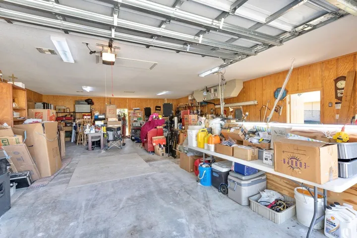 additional air conditioned 1,200 sqft detached garage (fit 6 cars total!) - that’s 1,640sqft of garage space total!! This second garage is a dream in itself – a paradise for hobbyists, car enthusiasts, or potential investors - as it is a 40’ x 30’ detached garage constructed of solid block (not wood frame) and ideal for a workshop, working on cars (deep enough for tandem parking) or opportunity for investment income by converting to a living space, as it has its own HVAC system, electrical breaker and account with FPL. Oversized parking pad on the attached garage for your bigger vehicles while having an additional parking pad (30’ x 27’) ideal for your toys or RV on the second detached garage.