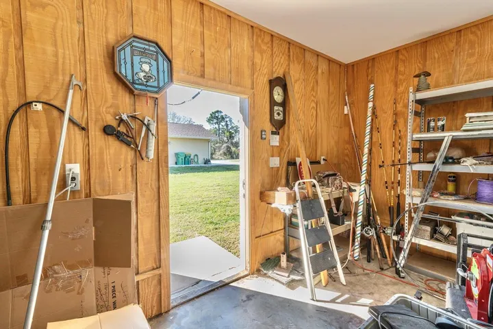 additional air conditioned 1,200 sqft detached garage (fit 6 cars total!) - that’s 1,640sqft of garage space total!! This second garage is a dream in itself – a paradise for hobbyists, car enthusiasts, or potential investors - as it is a 40’ x 30’ detached garage constructed of solid block (not wood frame) and ideal for a workshop, working on cars (deep enough for tandem parking) or opportunity for investment income by converting to a living space, as it has its own HVAC system, electrical breaker and account with FPL. Oversized parking pad on the attached garage for your bigger vehicles while having an additional parking pad (30’ x 27’) ideal for your toys or RV on the second detached garage.