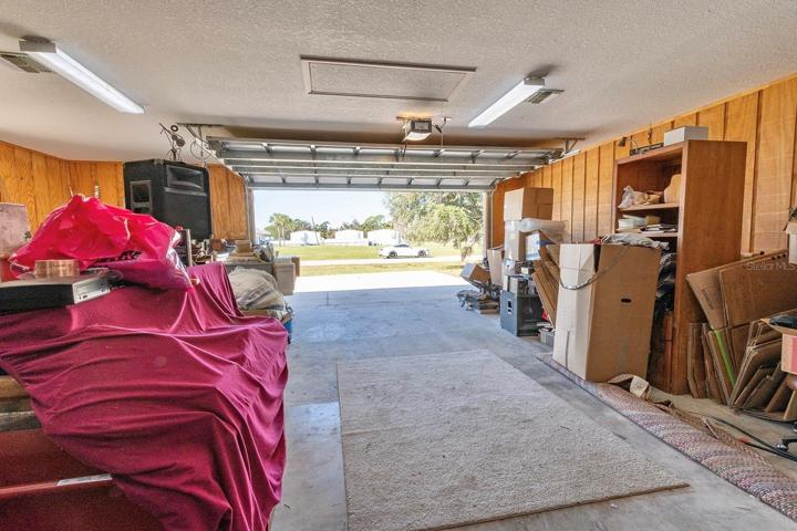 additional air conditioned 1,200 sqft detached garage (fit 6 cars total!) - that’s 1,640sqft of garage space total!! This second garage is a dream in itself – a paradise for hobbyists, car enthusiasts, or potential investors - as it is a 40’ x 30’ detached garage constructed of solid block (not wood frame) and ideal for a workshop, working on cars (deep enough for tandem parking) or opportunity for investment income by converting to a living space, as it has its own HVAC system, electrical breaker and account with FPL. Oversized parking pad on the attached garage for your bigger vehicles while having an additional parking pad (30’ x 27’) ideal for your toys or RV on the second detached garage.