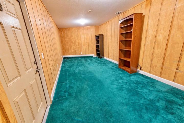 Porch professionally converted into a living space for a library, den, office, play room or workout room