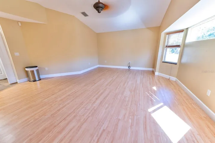 Huge family/great room right off the kitchen with room for a dinette or pub table. Leads into the library/office/den