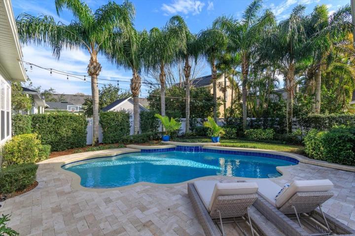 Private resort-style pool with lush landscaping