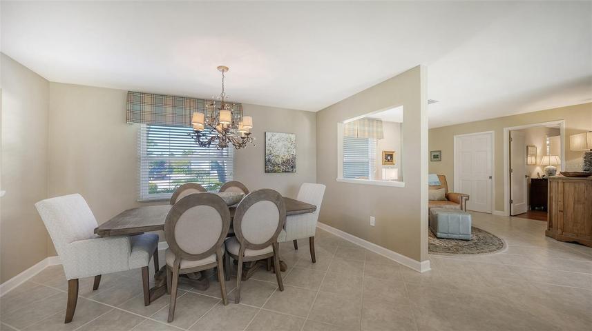 The ease for entertaining is created with blending the dining room flowing into the kitchen beautifully...