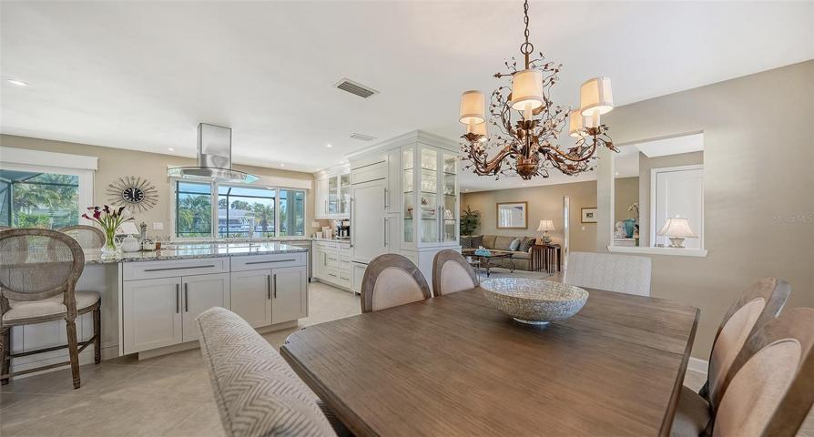 The dining room embraces the stunning gourmet kitchen