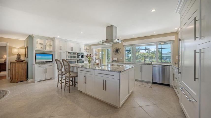 The expansive gourmet kitchen is a chef's delight to inspire everyone to cook !