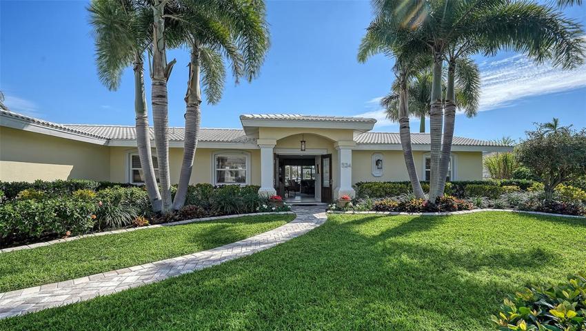 Lush & tropical landscaping abounds this magical property