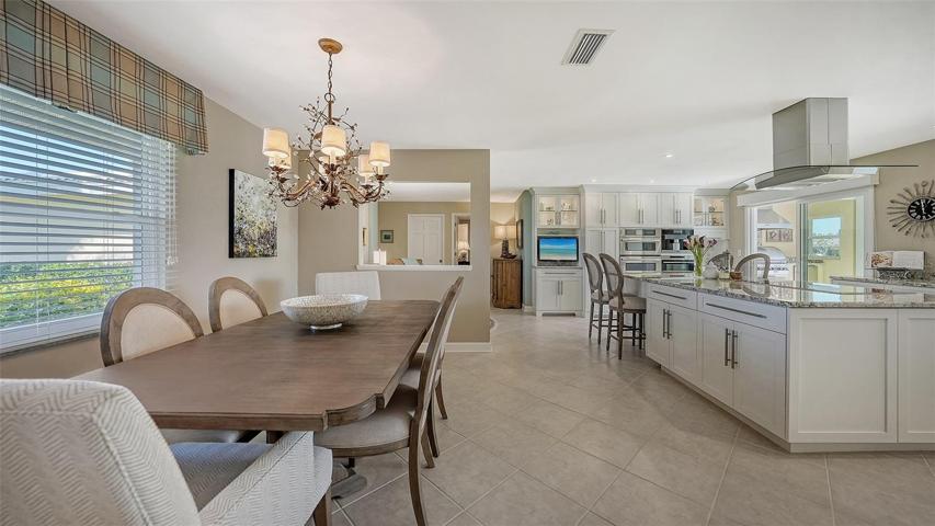 The elegant chandelier embraces the large dining room