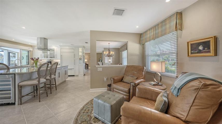 Enjoy your favorite show while having a cool beverage w/ the retractable TV within the cabinetry