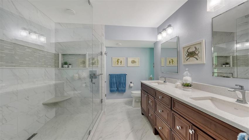 Quartz & porcelain just sparkle in this chic bathroom