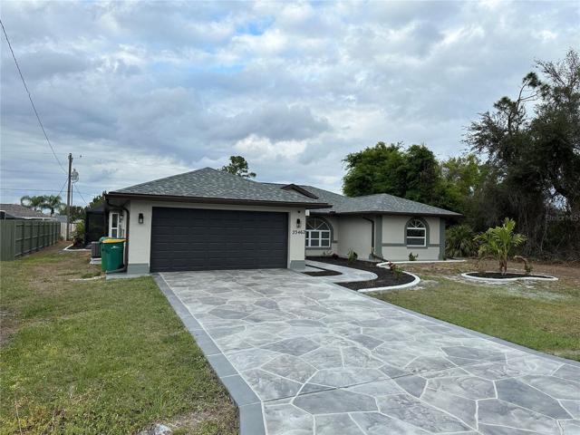 Beautiful driveway and front walk.  Note the concrete landscape borders - front and back.