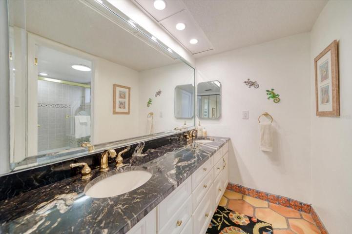 Primary bathroom with double vanities.