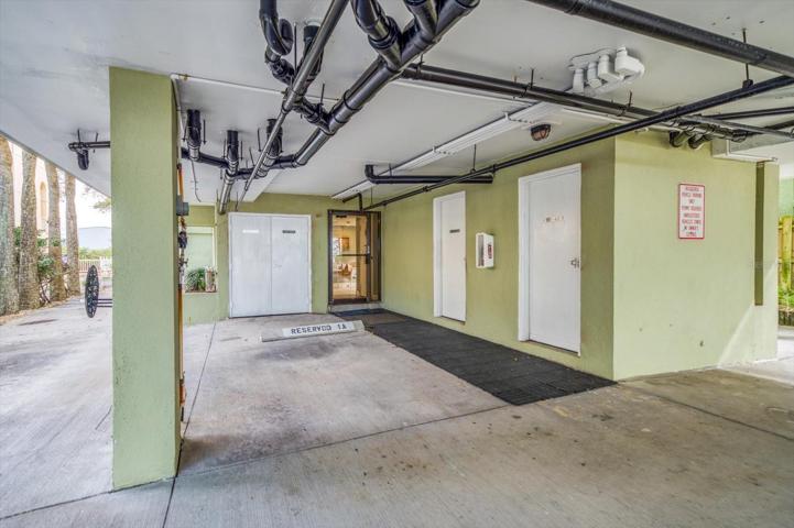 Owners parking spot next to large private storage