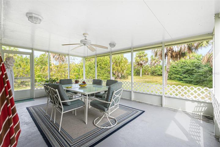 Enclosed porch overlooking the backyard.