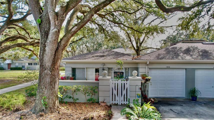 Walled patio and Garage Entrance with door opener