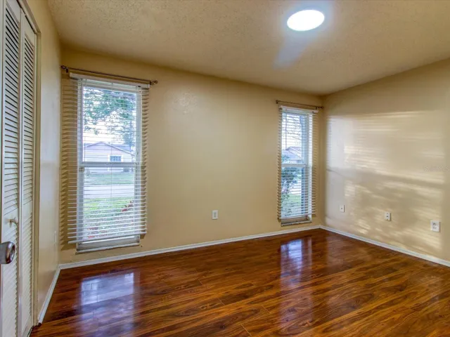 Bedroom 2 facing windows looking into front yard