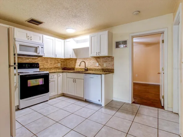 Kitchen with chic white shaker cabinets