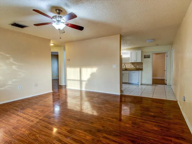 Living Room facing Kitchen and Primary Bedroom