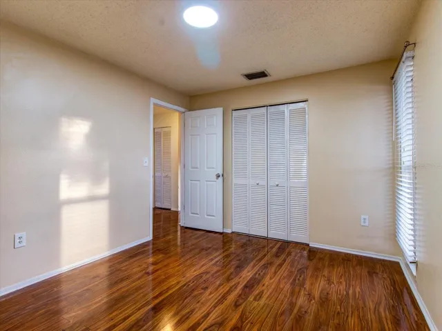 Bedroom 2 facing door and closet