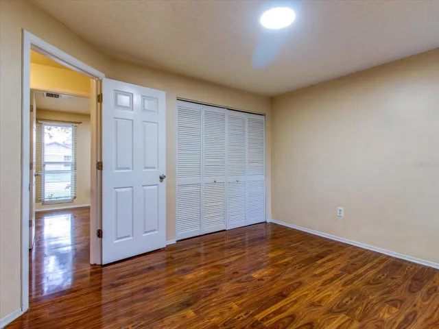 Bedroom 3 facing door and closet