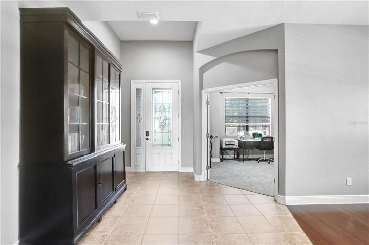 VIEW OF  ENTRANCE AND OFFICE - TO THE RIGHT OF THIS PHOTO, PART OF THE DINING ROOM IS SHOWING
