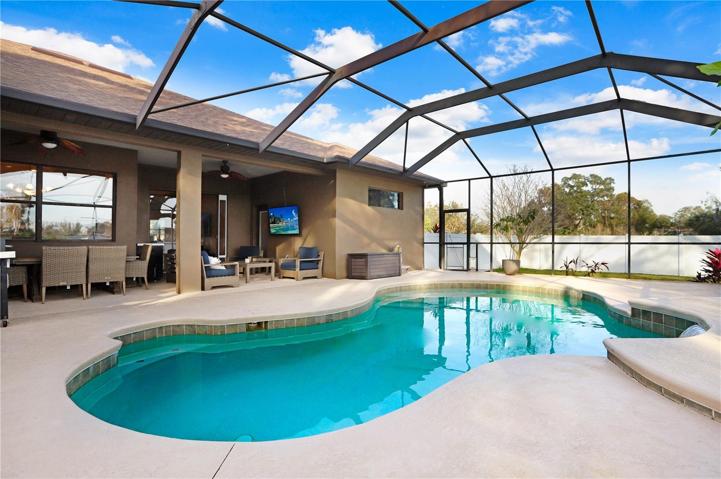 SALT WATER POOL, COVERED & SCREENED-IN LANAI - 2 SCREEN DOOR EXITS TO THE BACKYARD