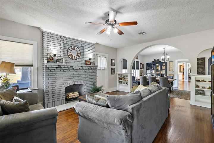 Gleaming wood floors, cozy fireplace, wonderful details!