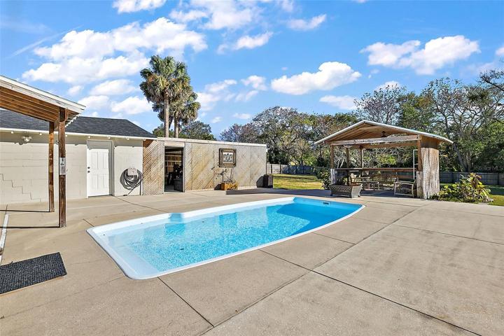 There are 2 gazebo/entertaining areas, and entry to the garage, workshop and storage area