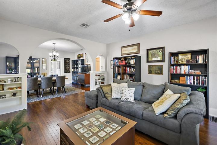 Wood floors flow into the dining and kitchen, framed by original built ins!