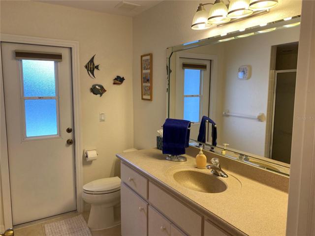 Bath 2 & Exit Door to Pool