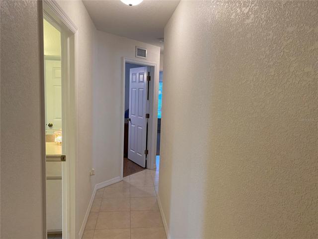 Hallway to additional Bedrooms and Bath